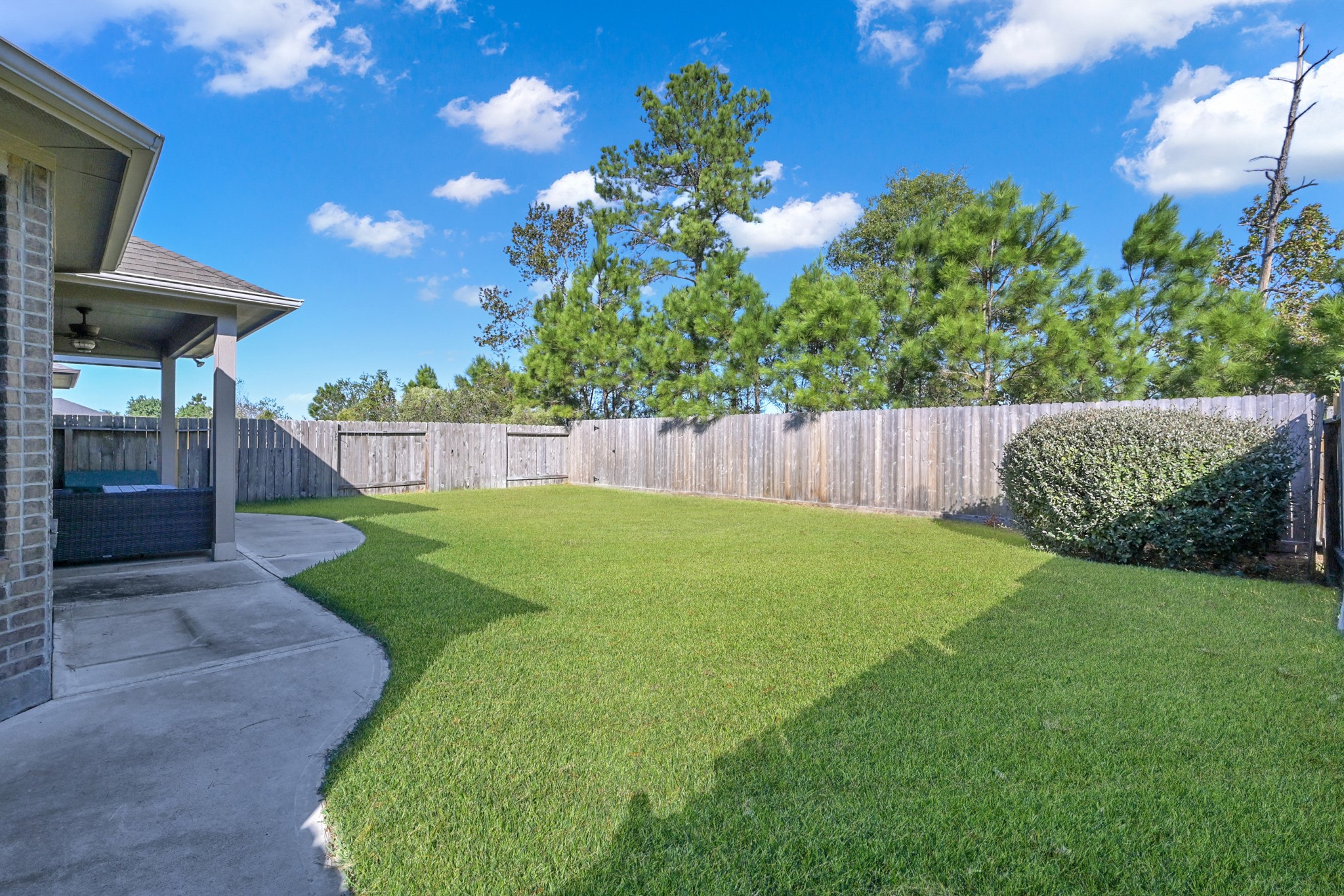 31851 Chapel Rock Lane Spring, TX 77386 - Photo 36 of 50 a view of a backyard with a garden