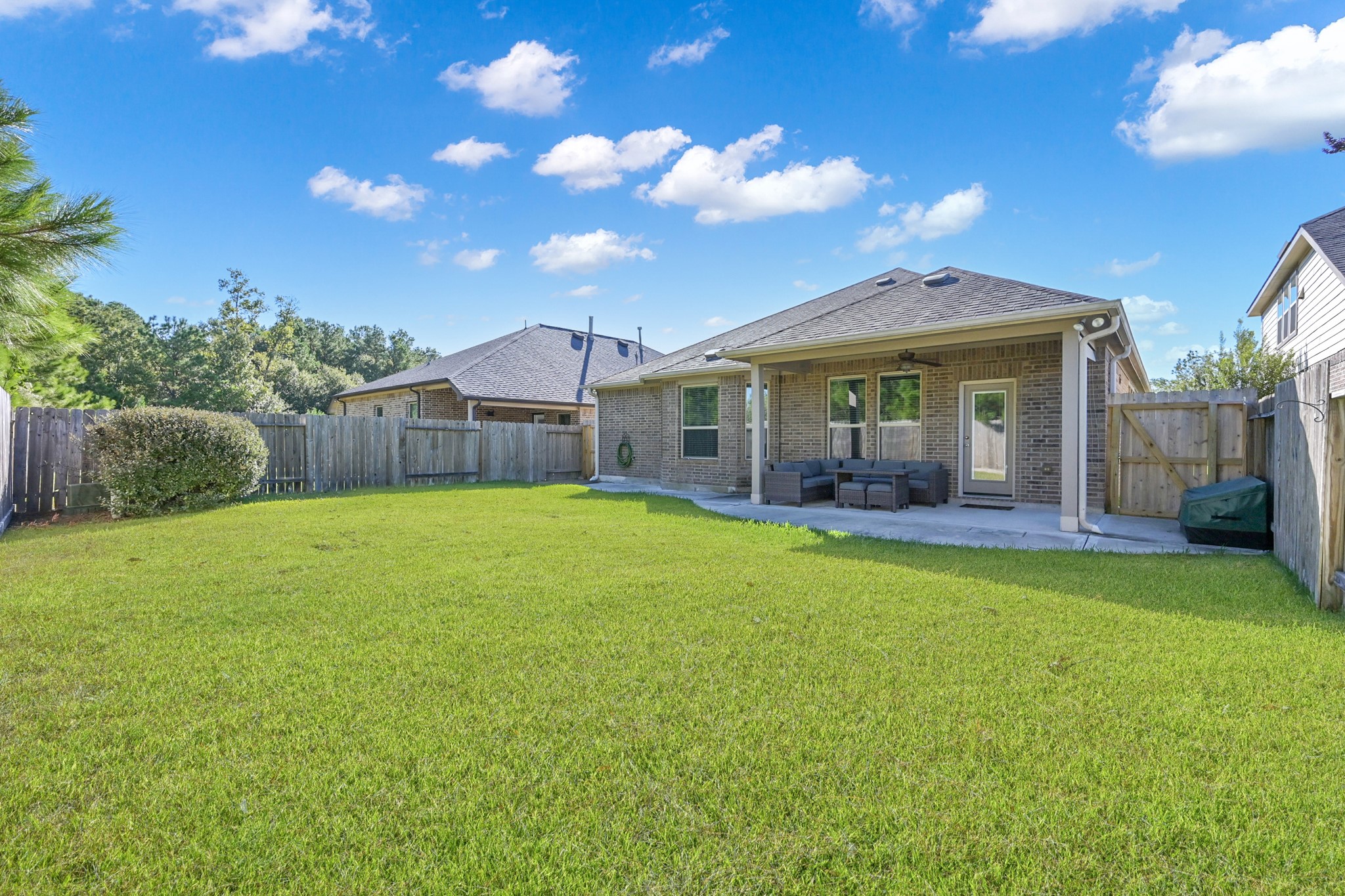 31851 Chapel Rock Lane Spring, TX 77386 - Photo 39 of 50 a view of a house with a backyard