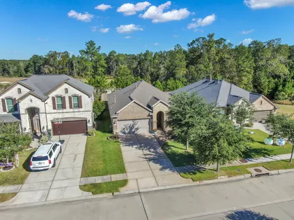 an aerial view of a house with outdoor space