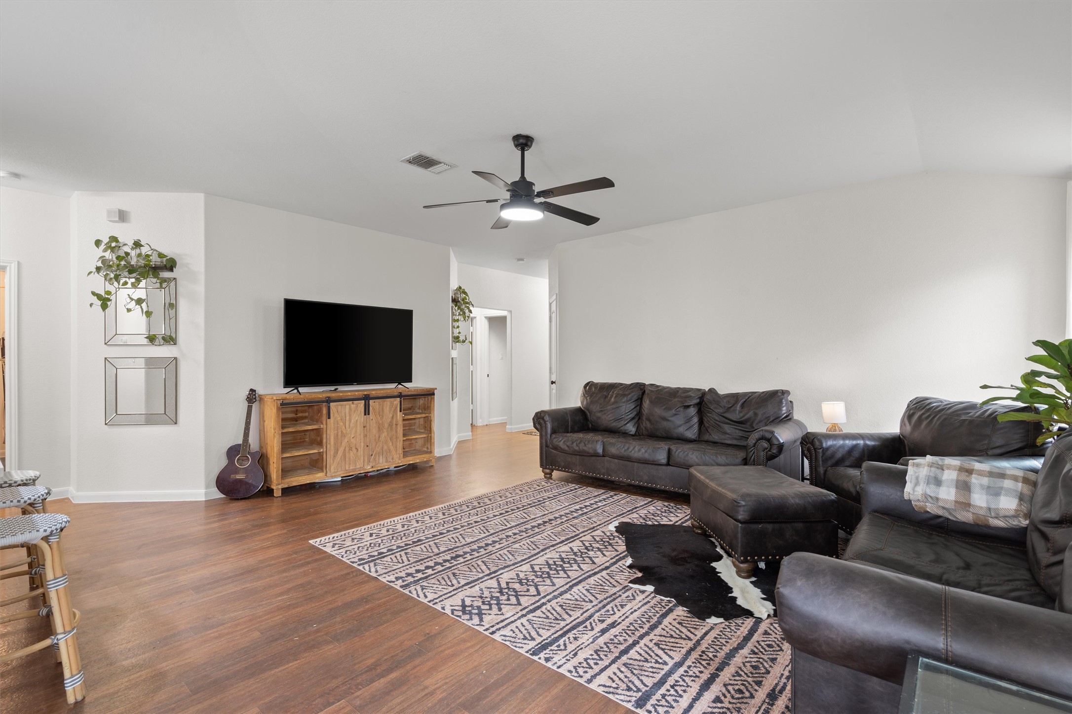 606 Old Peak Road Georgetown, TX 78626 - Photo 10 of 23 a living room with furniture and a flat screen tv