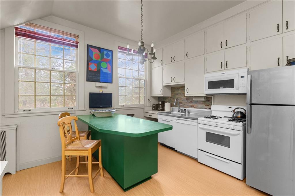 804 Persimmon Road Sewickley, PA 15143 - Photo 17 of 43 a kitchen with stainless steel appliances granite countertop a stove and a refrigerator