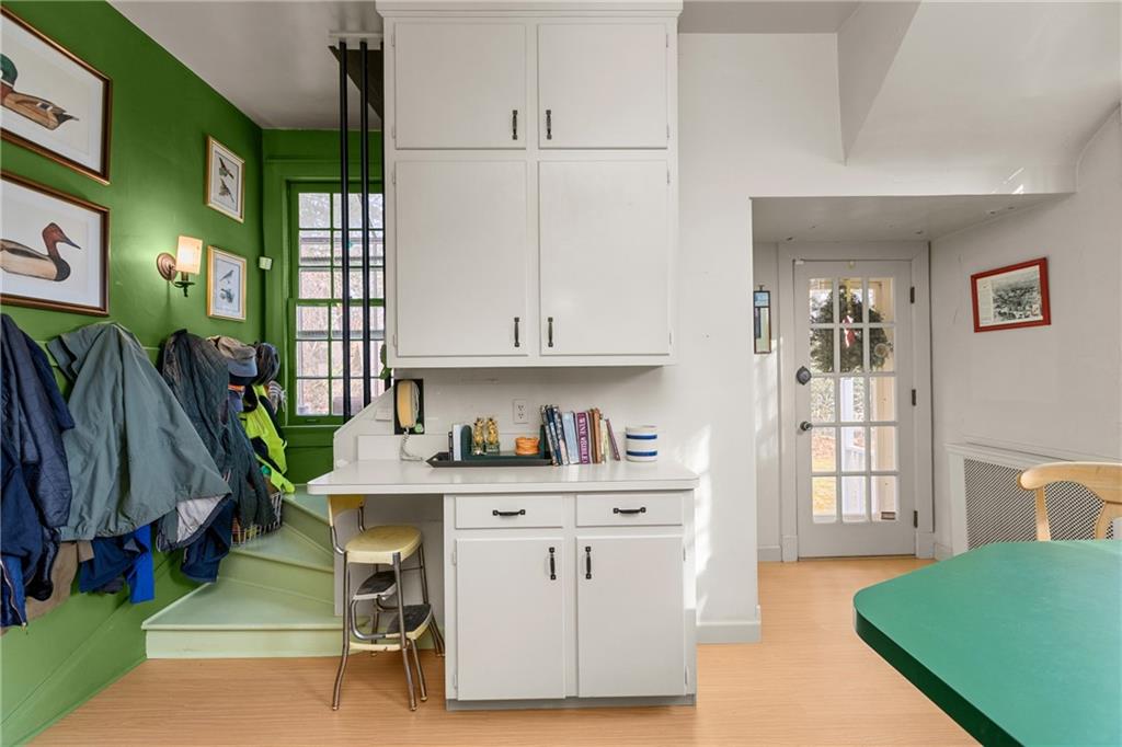 804 Persimmon Road Sewickley, PA 15143 - Photo 18 of 43 a living room with furniture a flat screen tv and a floor to ceiling window