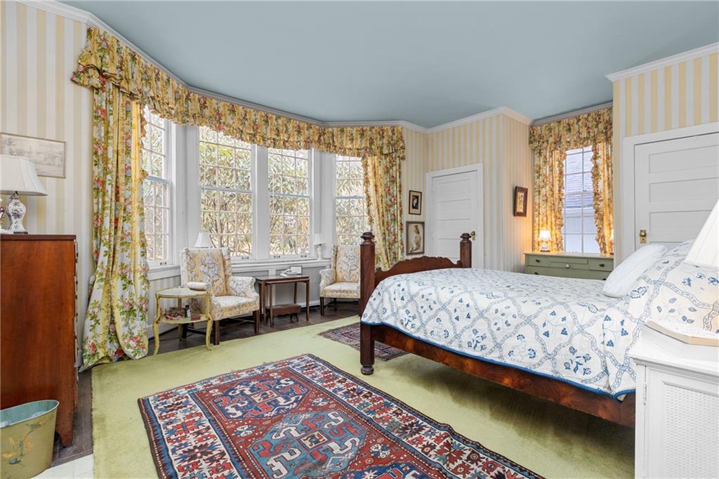 804 Persimmon Road Sewickley, PA 15143 - Photo 21 of 43 a bedroom with a bed and large windows