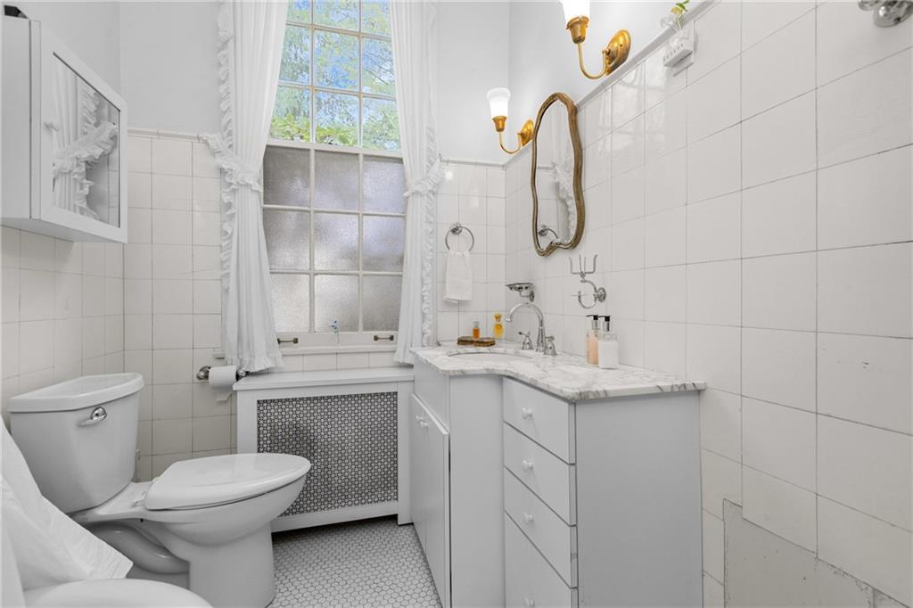804 Persimmon Road Sewickley, PA 15143 - Photo 25 of 43 a bathroom with a granite countertop toilet sink and mirror