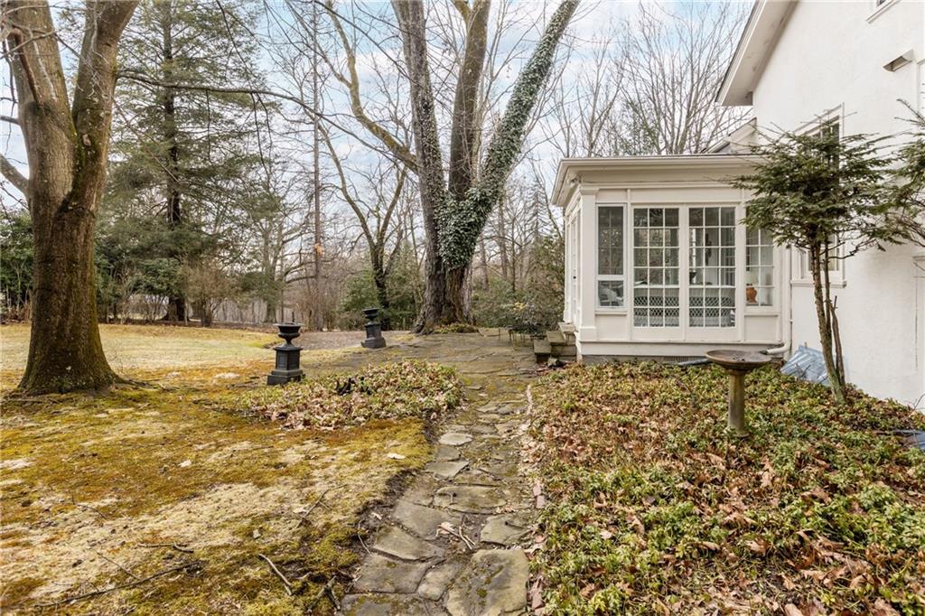 804 Persimmon Road Sewickley, PA 15143 - Photo 38 of 43 a front view of a house with a yard covered with snow