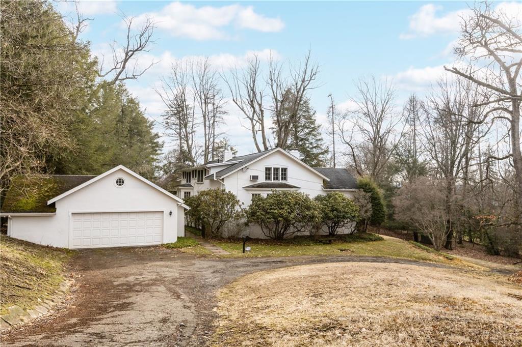 804 Persimmon Road Sewickley, PA 15143 - Photo 39 of 43 a front view of a house with a yard and garage