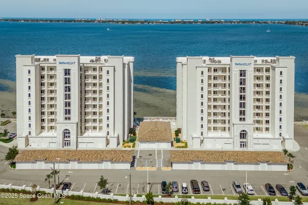 a view of a large building with a swimming pool