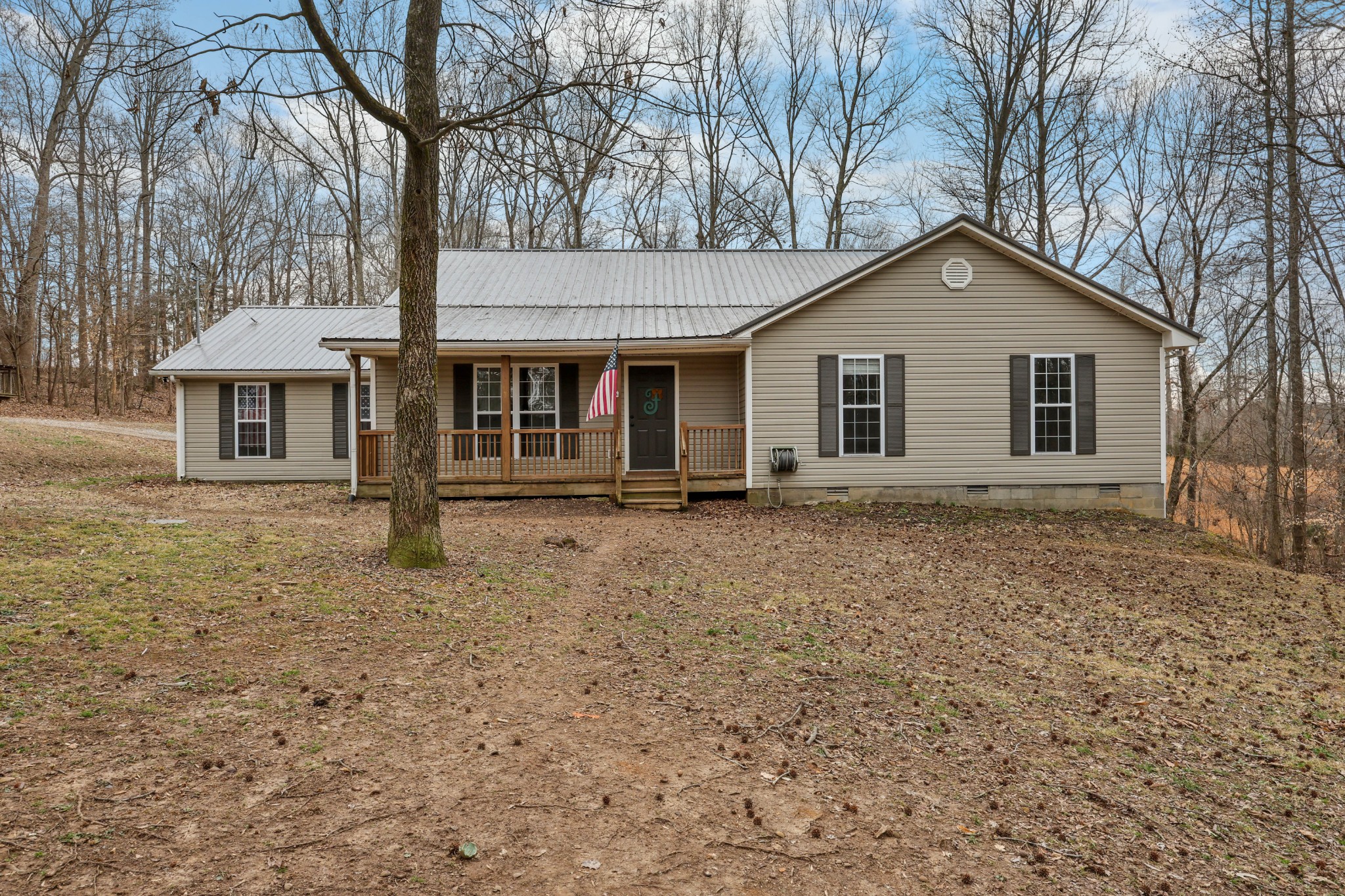 1201 Gallion Road Cumberland Furnace, TN 37051 - Photo 1 of 29 a house with trees in the background