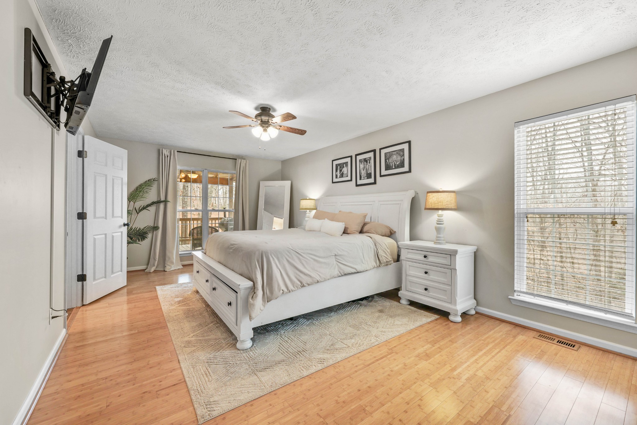 1201 Gallion Road Cumberland Furnace, TN 37051 - Photo 16 of 29 a bedroom with a large bed and a chandelier