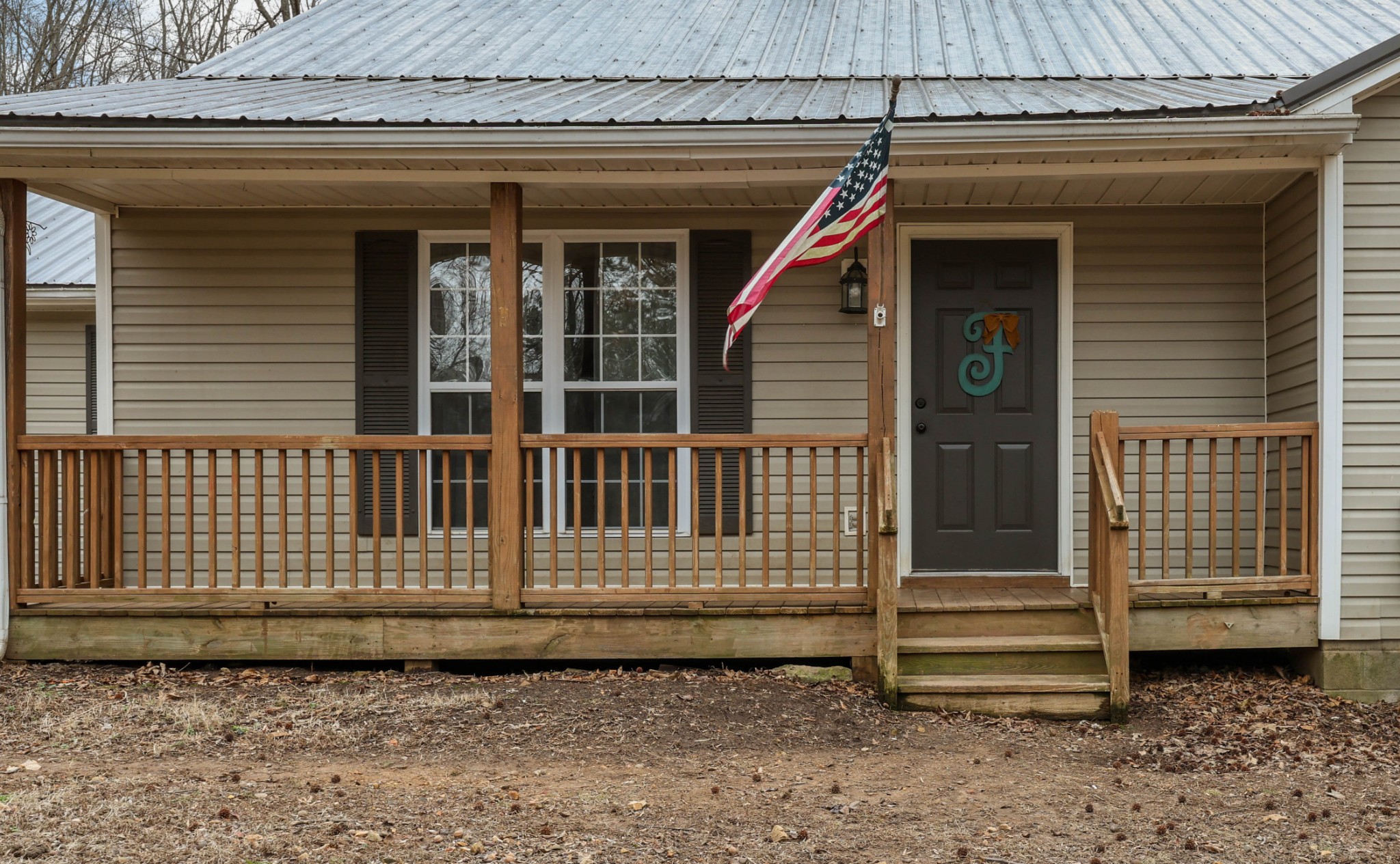 1201 Gallion Road Cumberland Furnace, TN 37051 - Photo 4 of 29 a front view of a house with a wooden fence