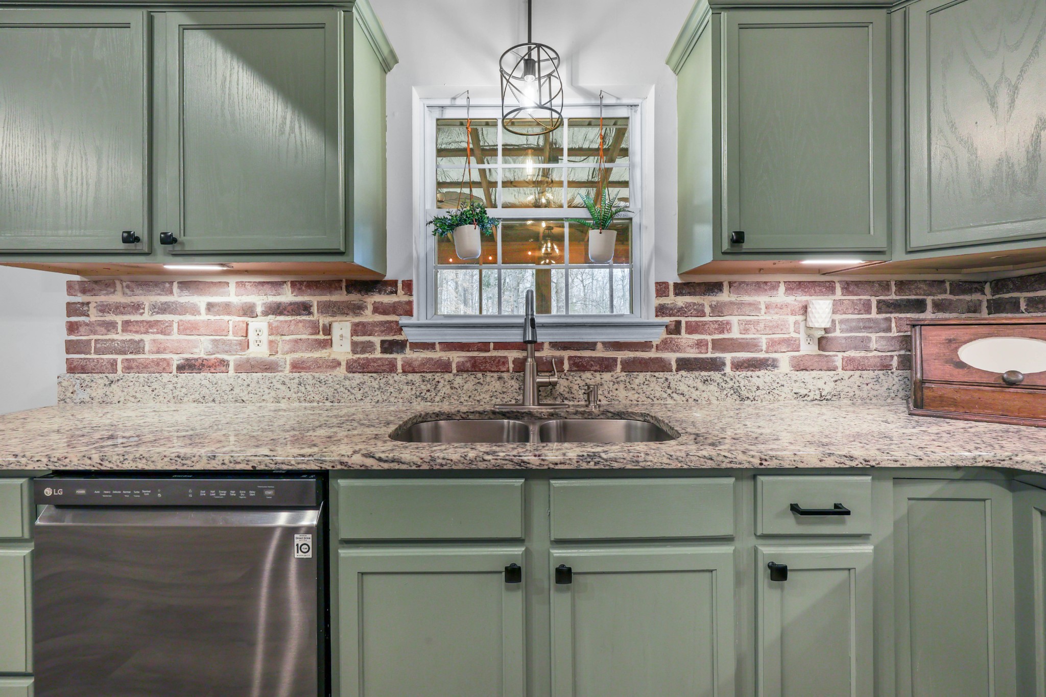 1201 Gallion Road Cumberland Furnace, TN 37051 - Photo 10 of 29 a kitchen with granite countertop a sink and a window