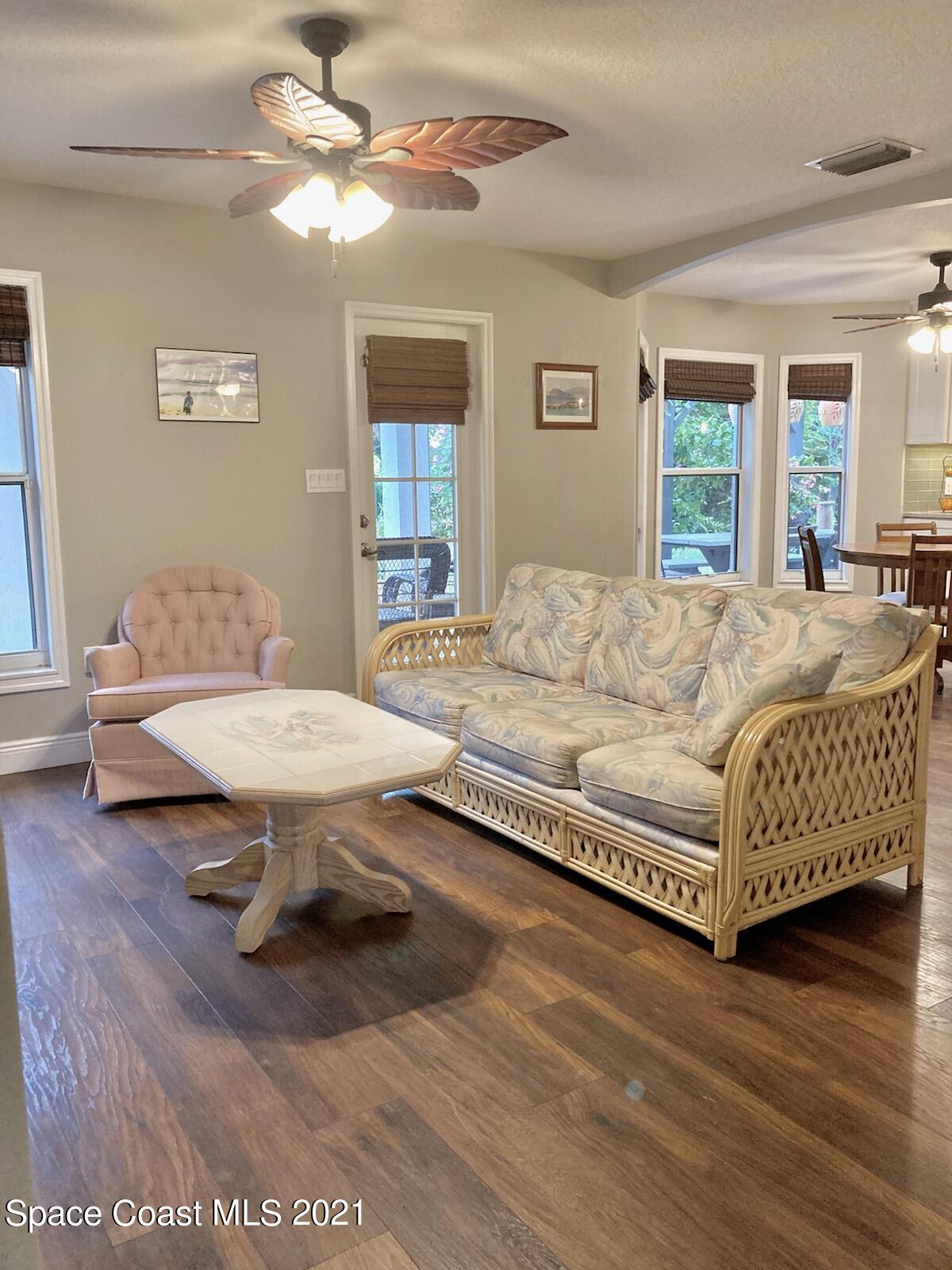 4155 Turtle Mound Road Melbourne, FL 32934 - Photo 13 of 33 a living room with furniture rug and window
