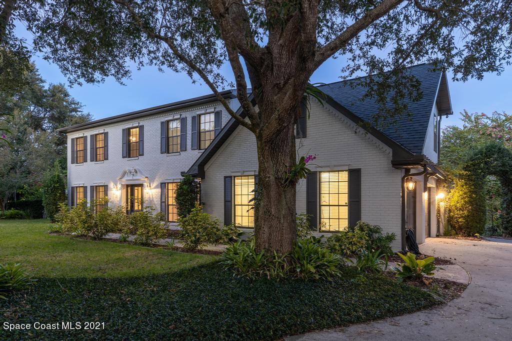 4155 Turtle Mound Road Melbourne, FL 32934 - Photo 2 of 33 a front view of a house with garden