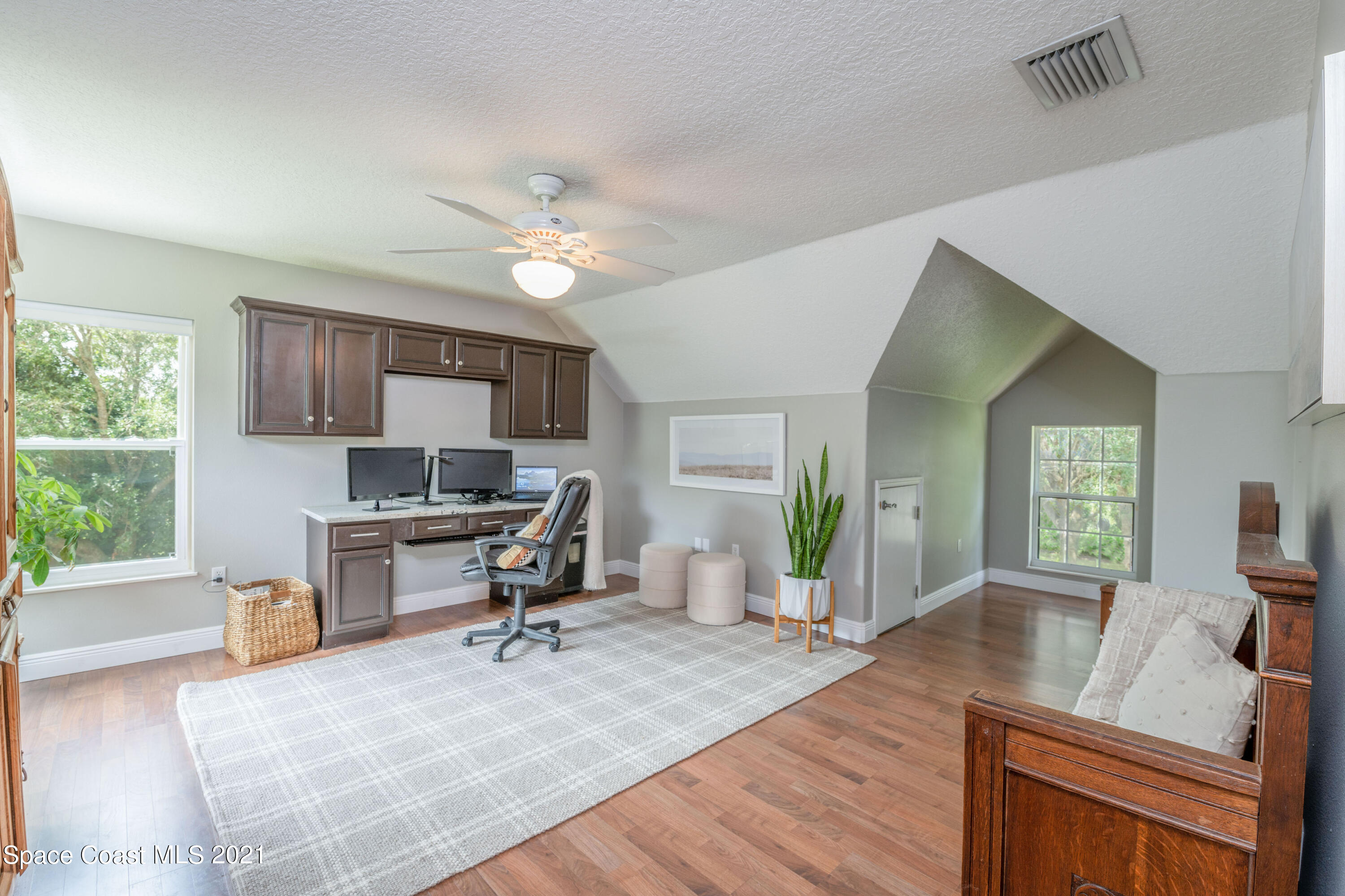4155 Turtle Mound Road Melbourne, FL 32934 - Photo 24 of 33 a living room with furniture and a kitchen view
