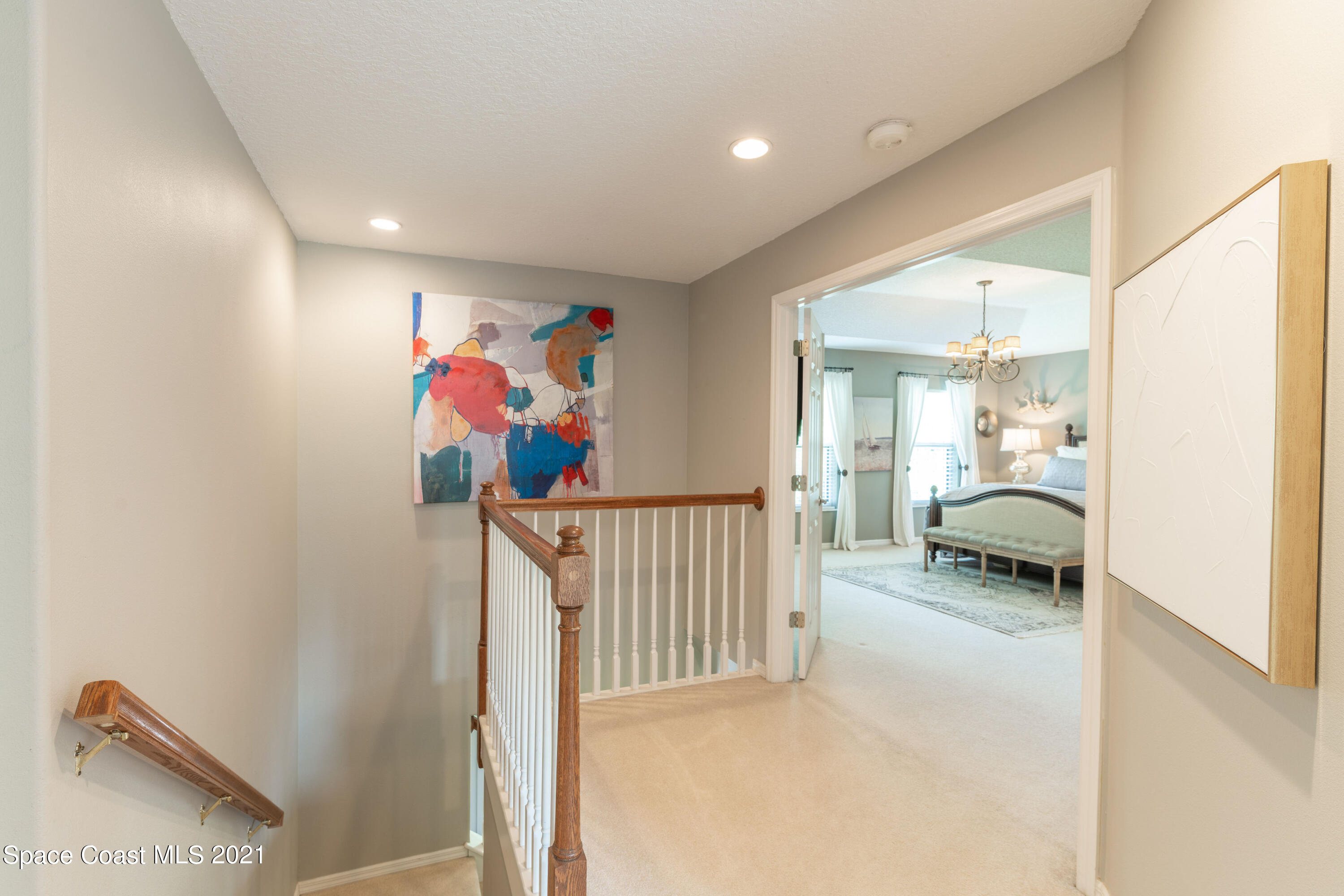 4155 Turtle Mound Road Melbourne, FL 32934 - Photo 25 of 33 a bedroom with furniture and a ceiling fan
