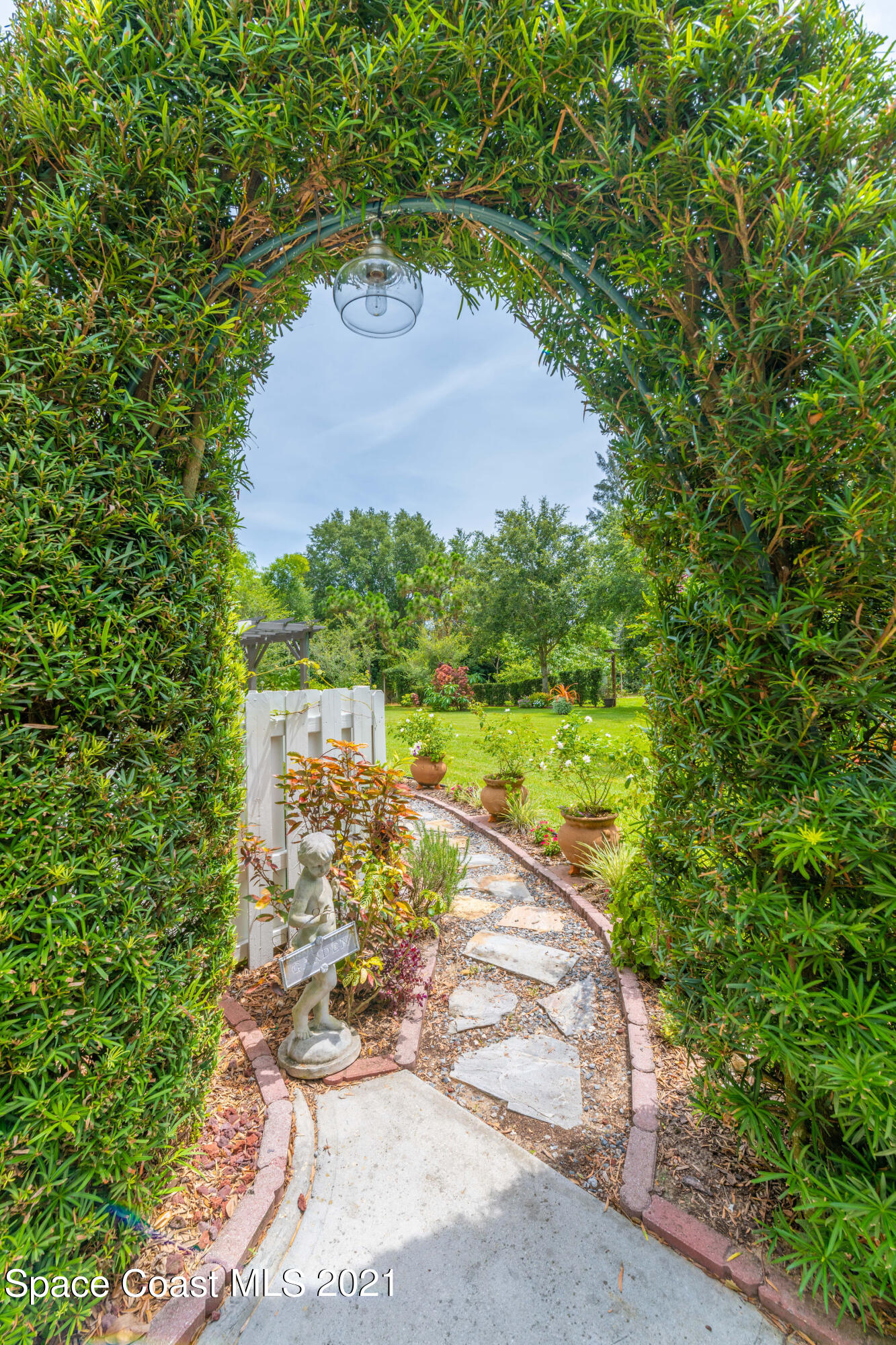 4155 Turtle Mound Road Melbourne, FL 32934 - Photo 31 of 33 a view of a lake from a yard