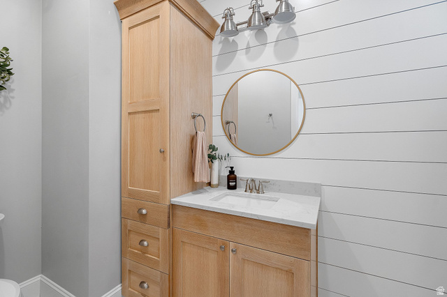 2917 Old Farm Road Washington, UT 84780 - Photo 59 of 105 Bathroom featuring vanity and wooden walls