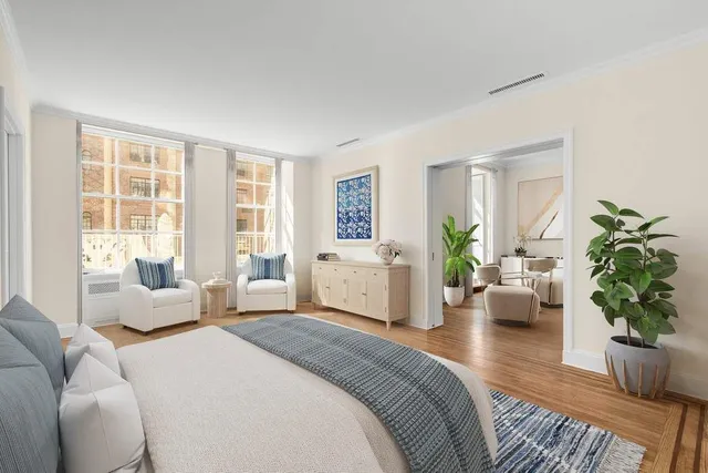 a bedroom with bed and a couch