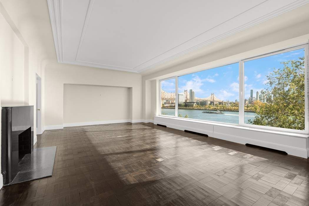 435 East 52nd Street, Unit 3A Manhattan, NY 10022 - Photo 27 of 35 a view of a living room hardwood floor and a large window
