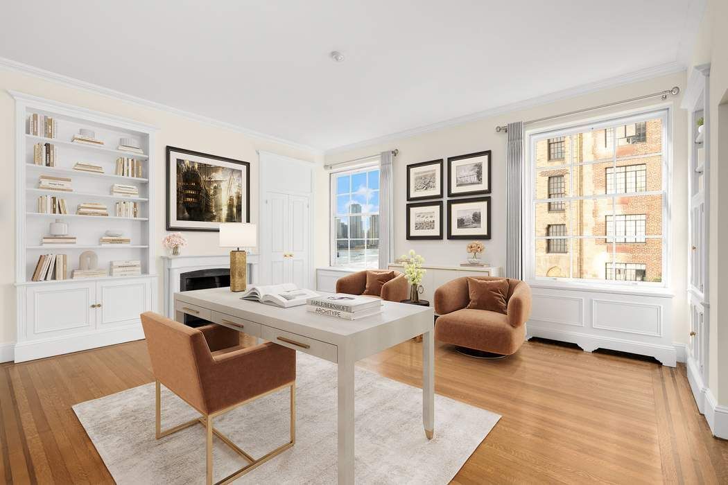 435 East 52nd Street, Unit 3A Manhattan, NY 10022 - Photo 8 of 35 a living room with furniture and a flat screen tv