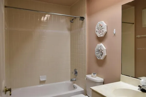 a bathroom with a shower and toilet