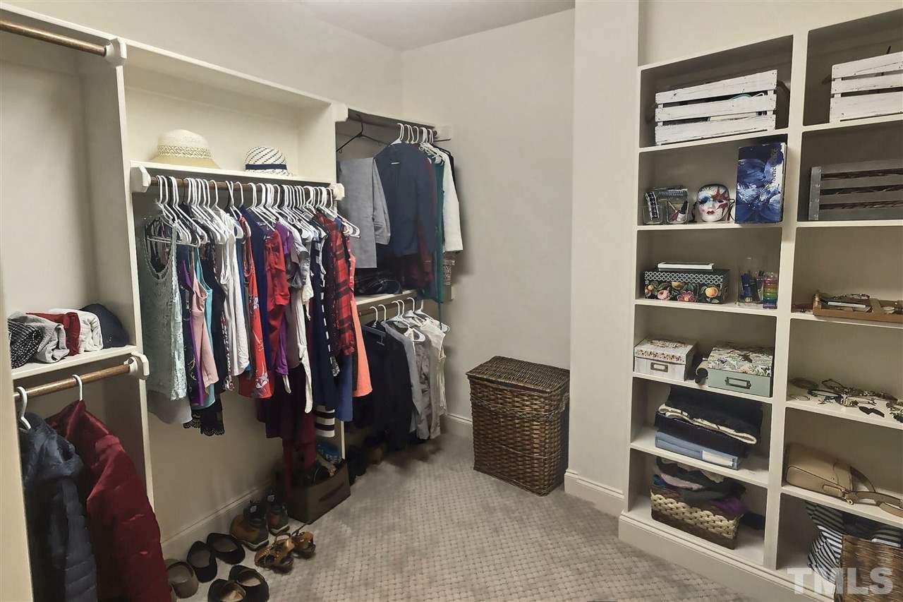 9328 Tabriz Point Raleigh, NC 27614 - Photo 24 of 29 a view of walk in closet with clothes and shoes