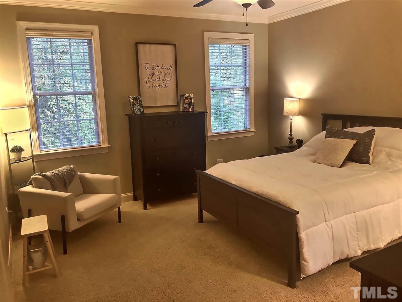 9328 Tabriz Point Raleigh, NC 27614 - Photo 10 of 29 a bedroom with a bed and a window