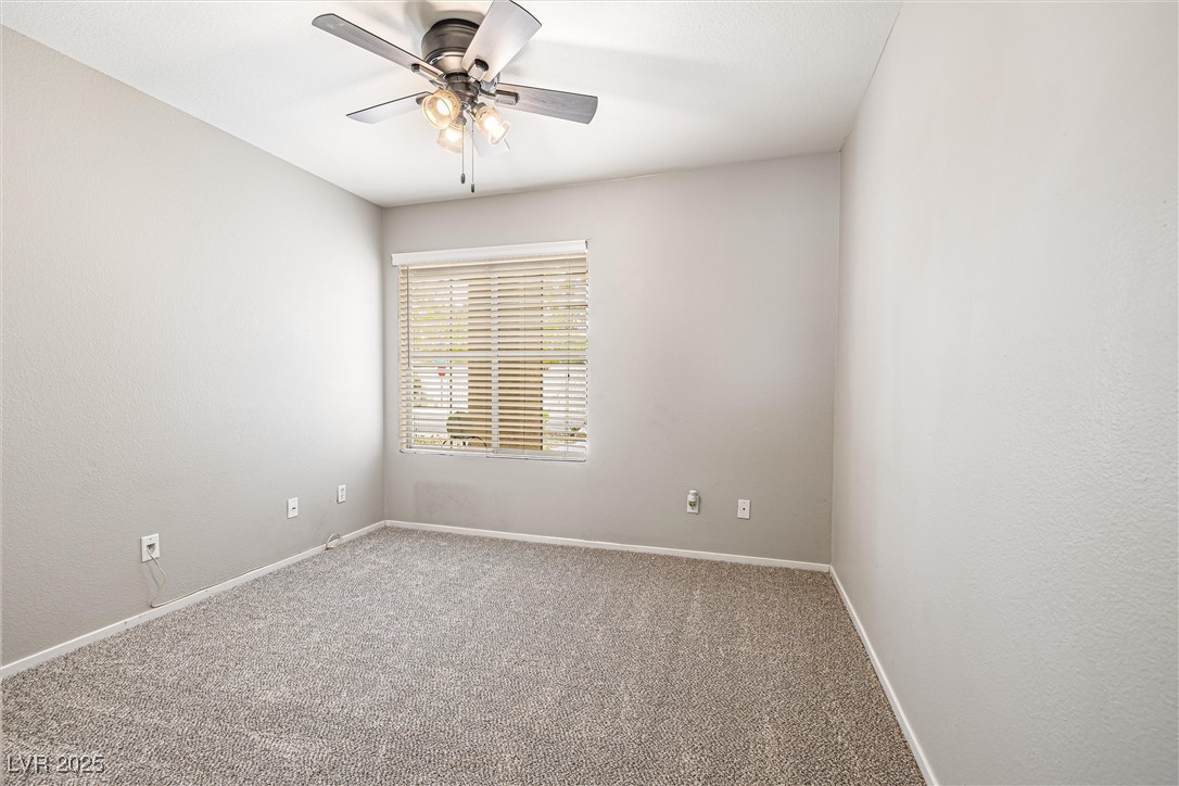 8878 Haviland Road Las Vegas, NV 89123 - Photo 21 of 58 Carpeted spare room featuring baseboards and ceiling fan