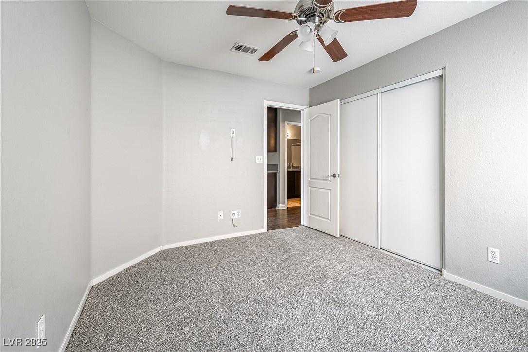 8878 Haviland Road Las Vegas, NV 89123 - Photo 32 of 58 Unfurnished bedroom featuring carpet flooring, a closet, and ceiling fan
