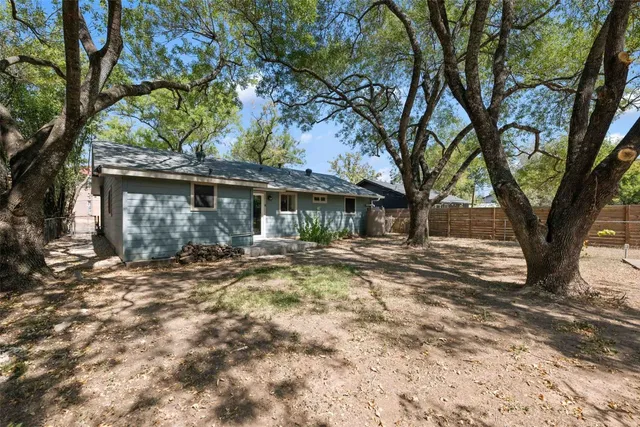a backyard of a house with a garden and outdoor space