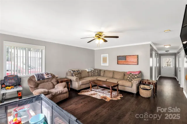 a living room with furniture fireplace and a flat screen tv