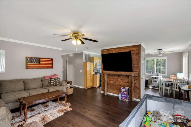 a living room with furniture window and wooden floor