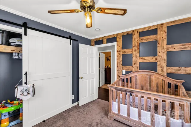 a view of a house with a backyard and garage