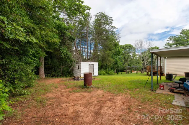 a backyard of a house with lots of green space