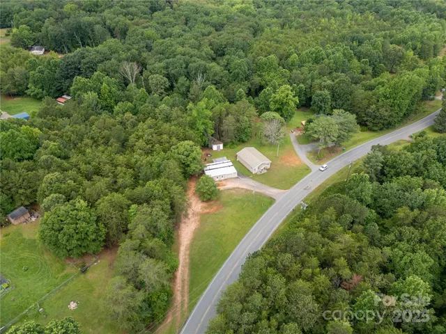 a view of a forest with a houses