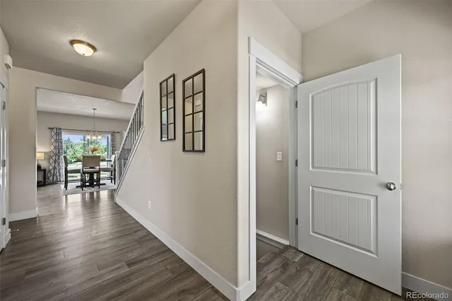 wooden floor with an entryway and a livingroom in right side