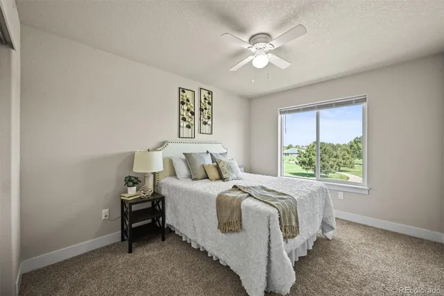 a bedroom with bed and a window