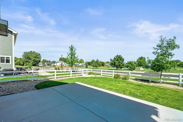 a view of a park and trees in the background