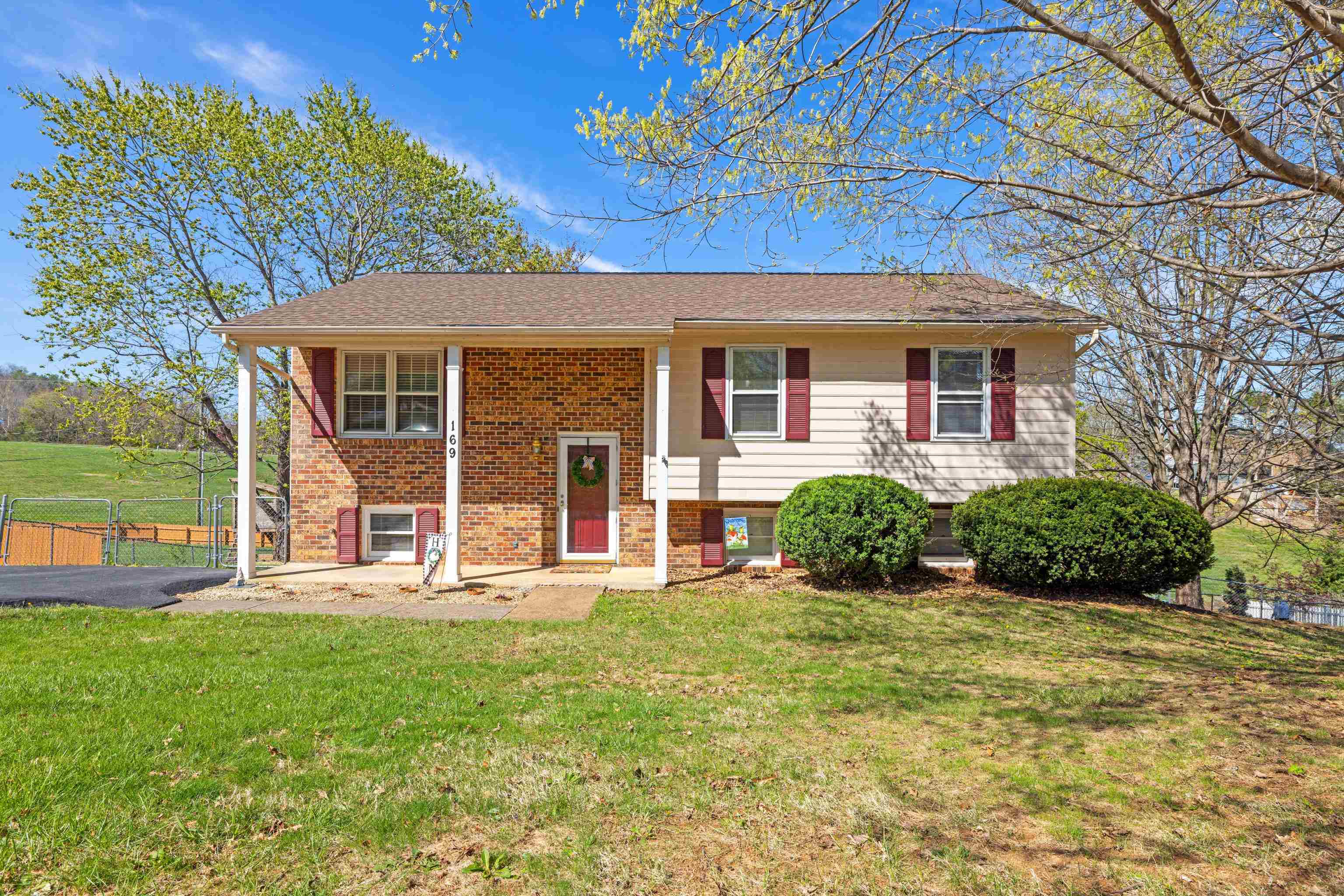 169 Mill Stone Drive Verona, VA 24482 - Photo 1 of 54 a front view of a house with a yard