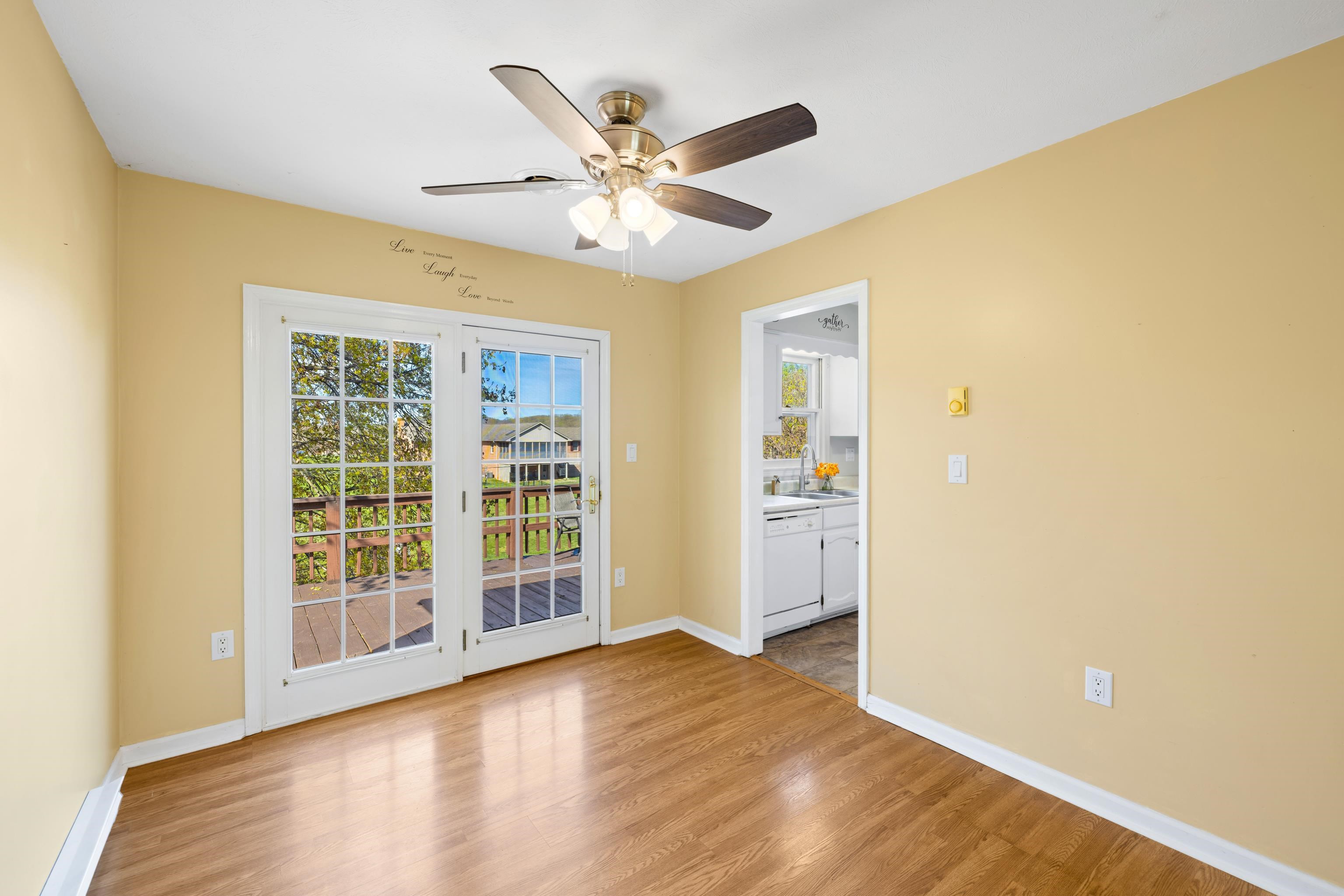 169 Mill Stone Drive Verona, VA 24482 - Photo 12 of 54 a view of an empty room with wooden floor and a window
