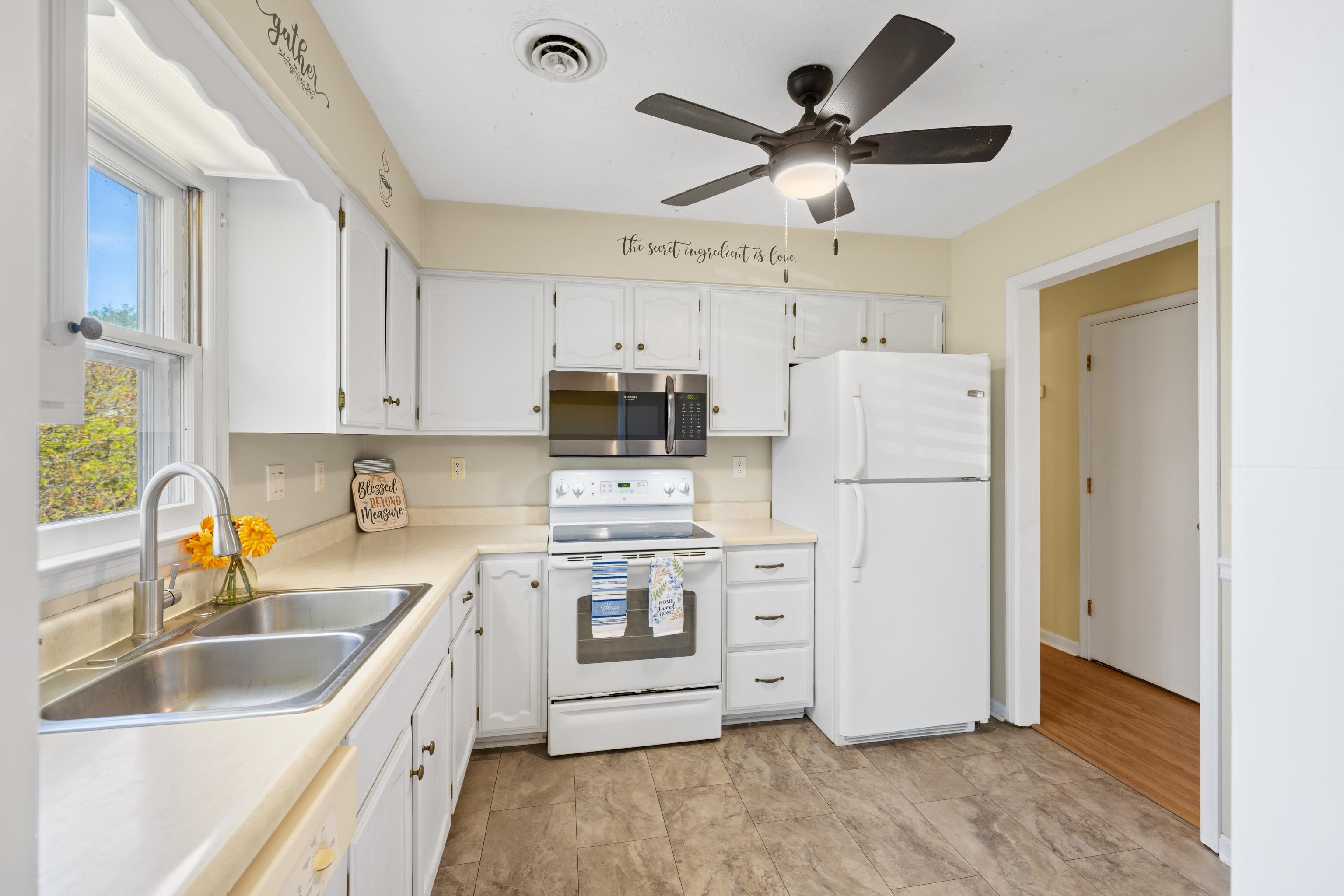 169 Mill Stone Drive Verona, VA 24482 - Photo 13 of 54 a kitchen with cabinets stainless steel appliances a sink and a refrigerator