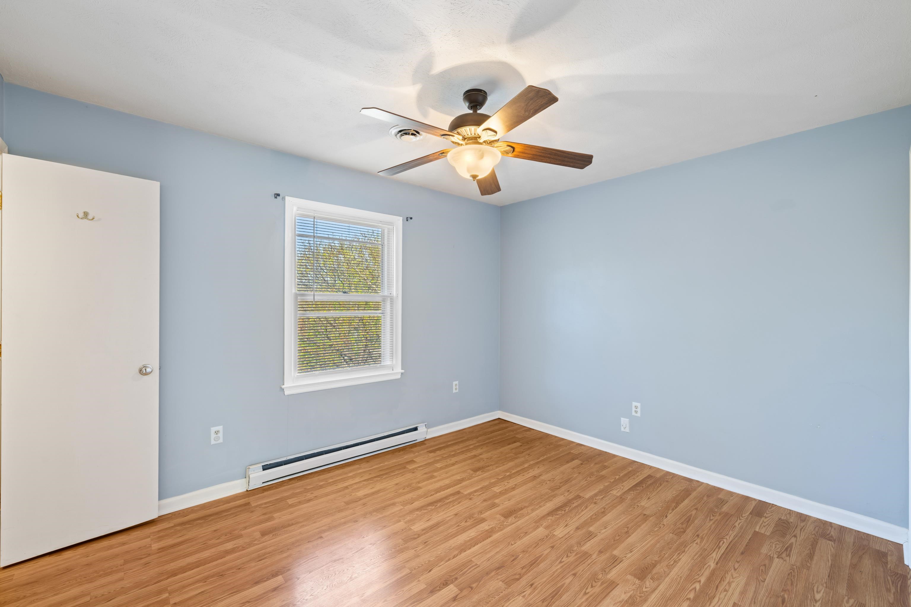 169 Mill Stone Drive Verona, VA 24482 - Photo 20 of 54 a view of an empty room with window and a chandelier fan