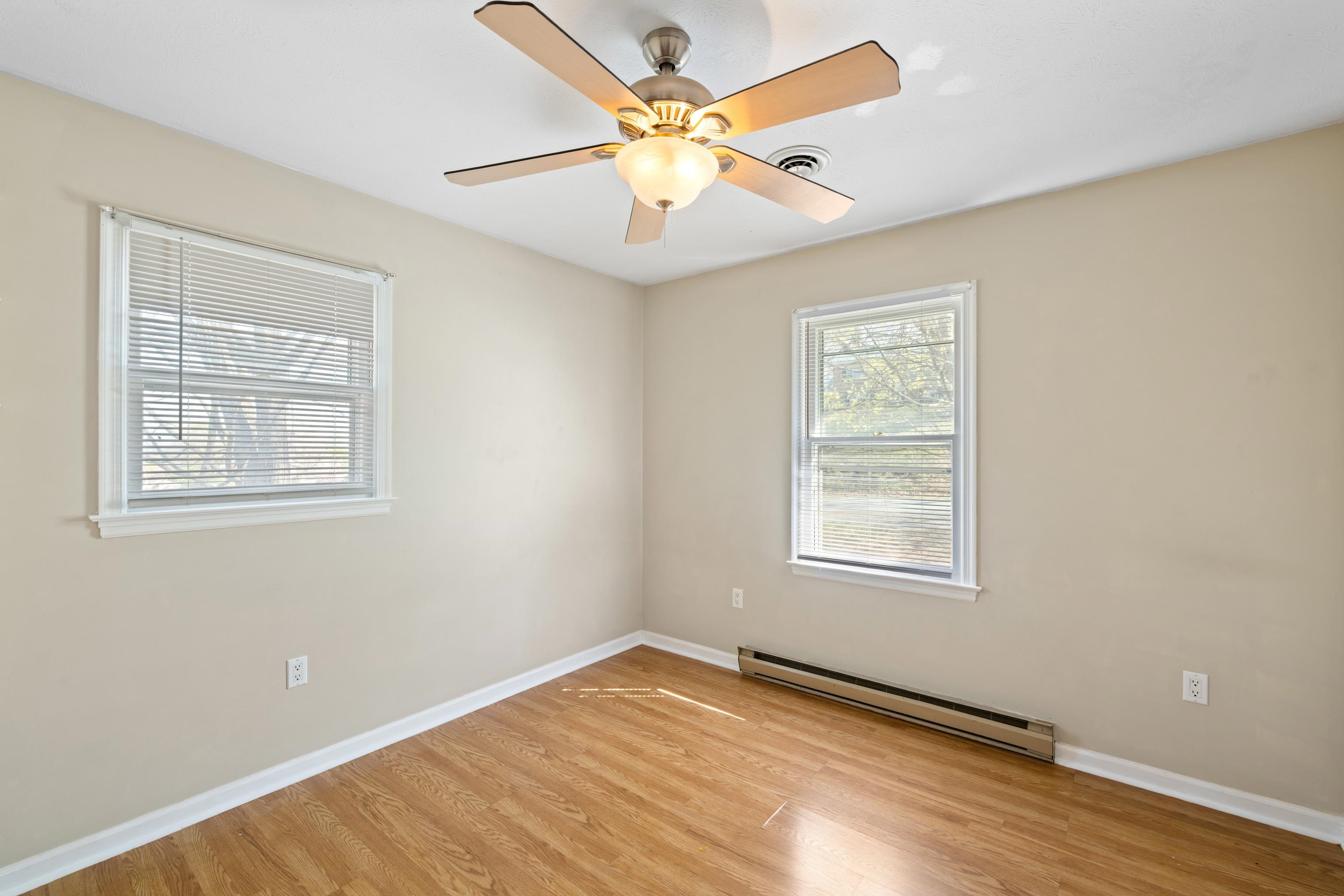 169 Mill Stone Drive Verona, VA 24482 - Photo 23 of 54 a view of an empty room with window and wooden floor