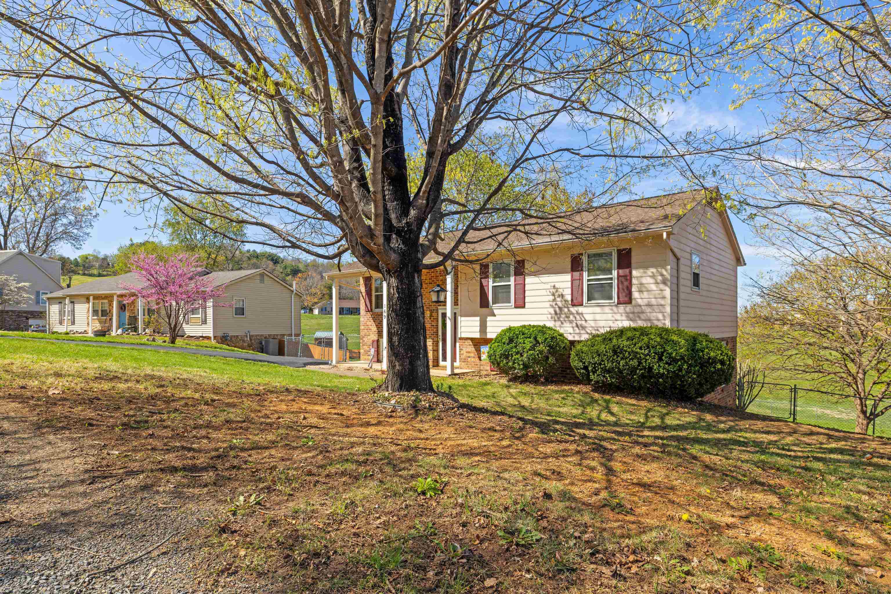 169 Mill Stone Drive Verona, VA 24482 - Photo 4 of 54 a front view of a house with a yard