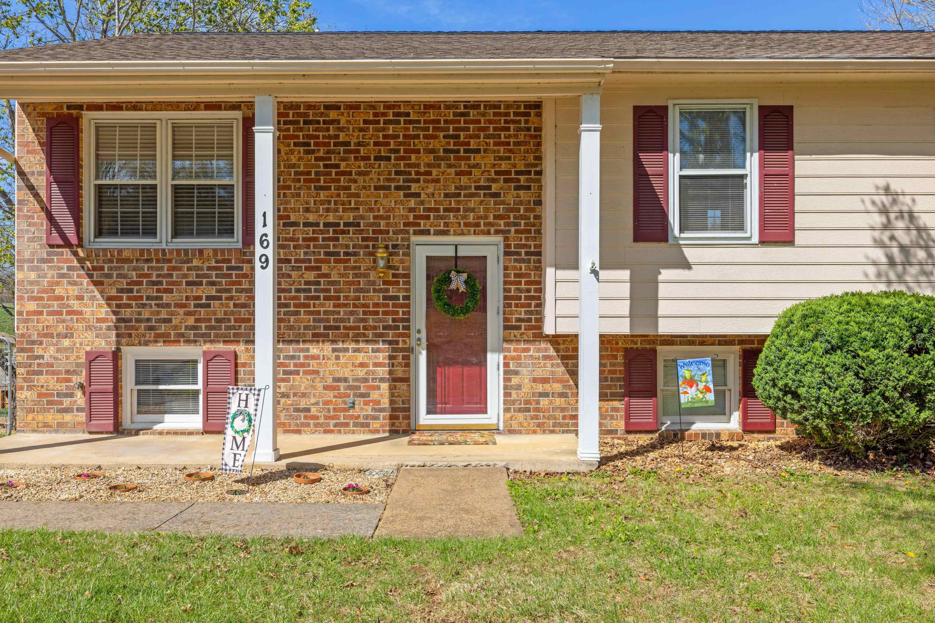 169 Mill Stone Drive Verona, VA 24482 - Photo 5 of 54 front view of a brick house with a small yard