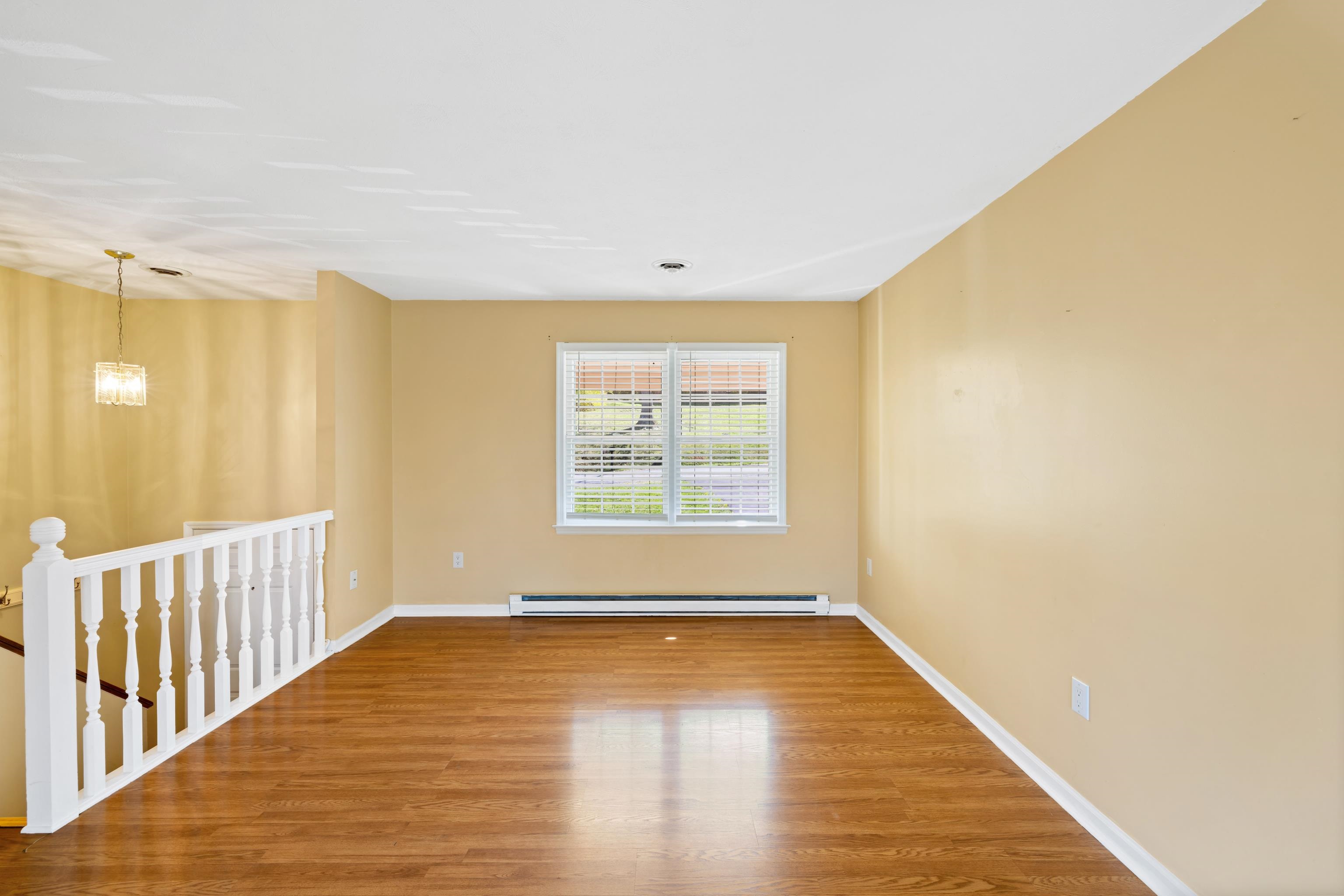 169 Mill Stone Drive Verona, VA 24482 - Photo 9 of 54 a view of empty room with wooden floor and fan