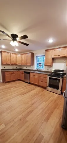 a kitchen with stainless steel appliances granite countertop a stove and a sink