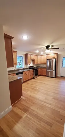 a large room with kitchen view