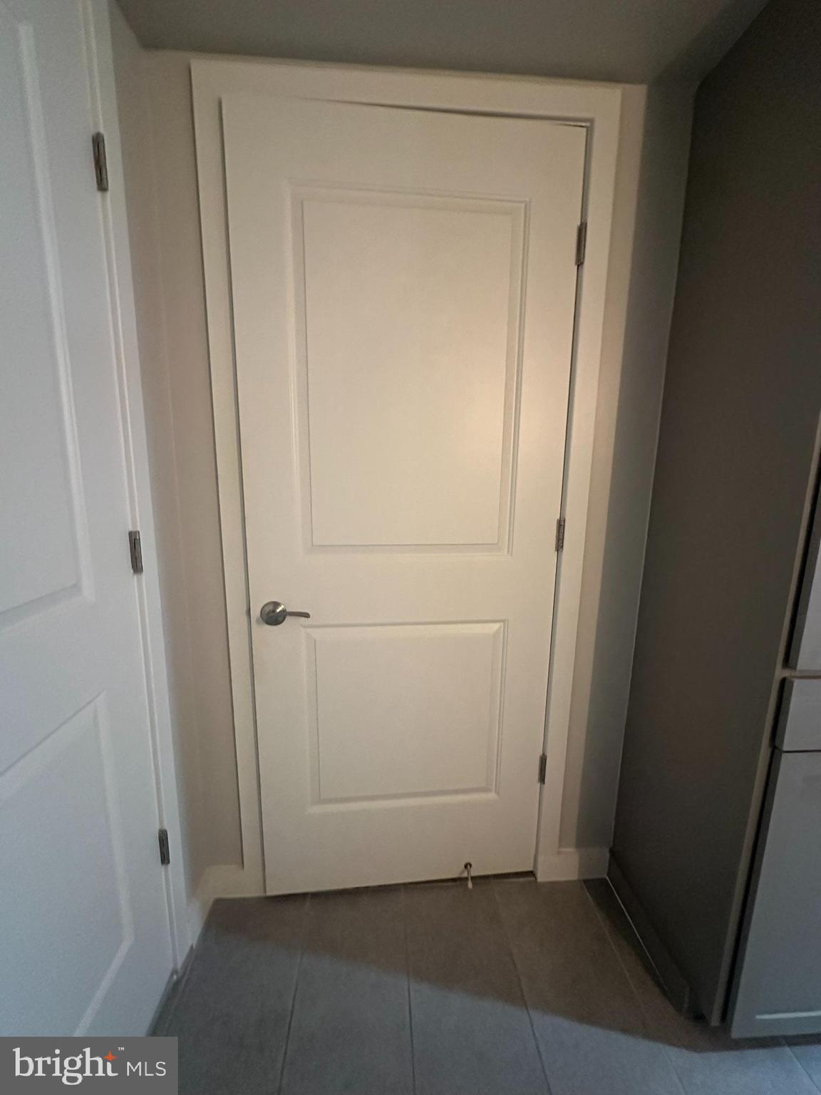 1025 First Street Southeast, Unit 901 Washington, DC 20003 - Photo 18 of 56 an empty room with wooden door