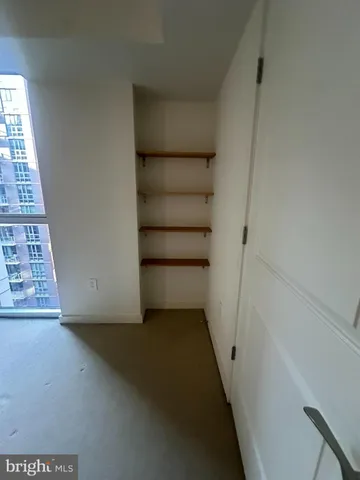 a bathroom with a shower and a sink